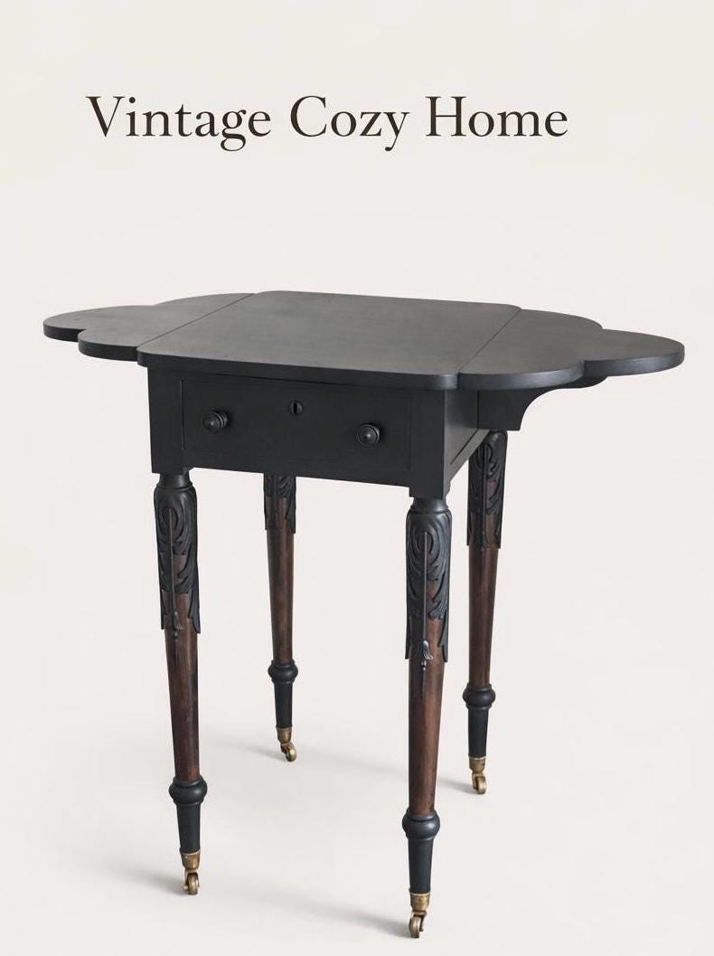 Elegant Antique  Black  Ornate Carved Table with antique casters.
