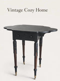 Elegant Antique  Black  Ornate Carved Table with antique casters.